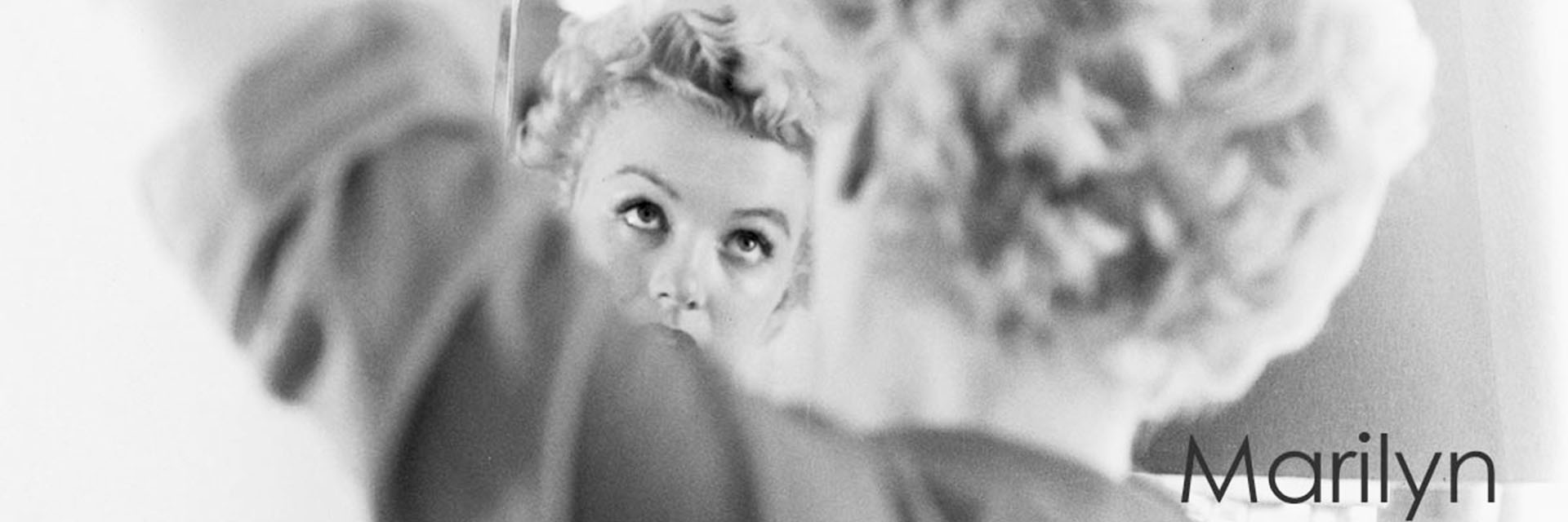 Blonde Marilyn Monroe checks herself in the mirror prints available from Galerie Prints